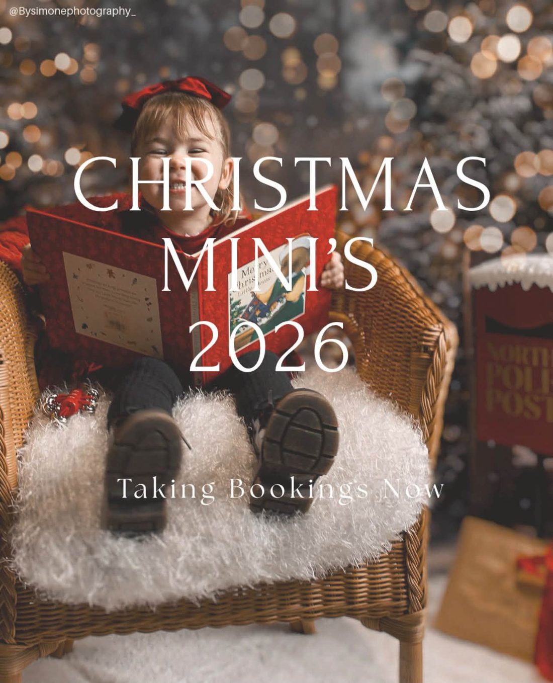 Toddler in a red bow laughing in a wicker chair with a Christmas book, Christmas Minis 2026 poster